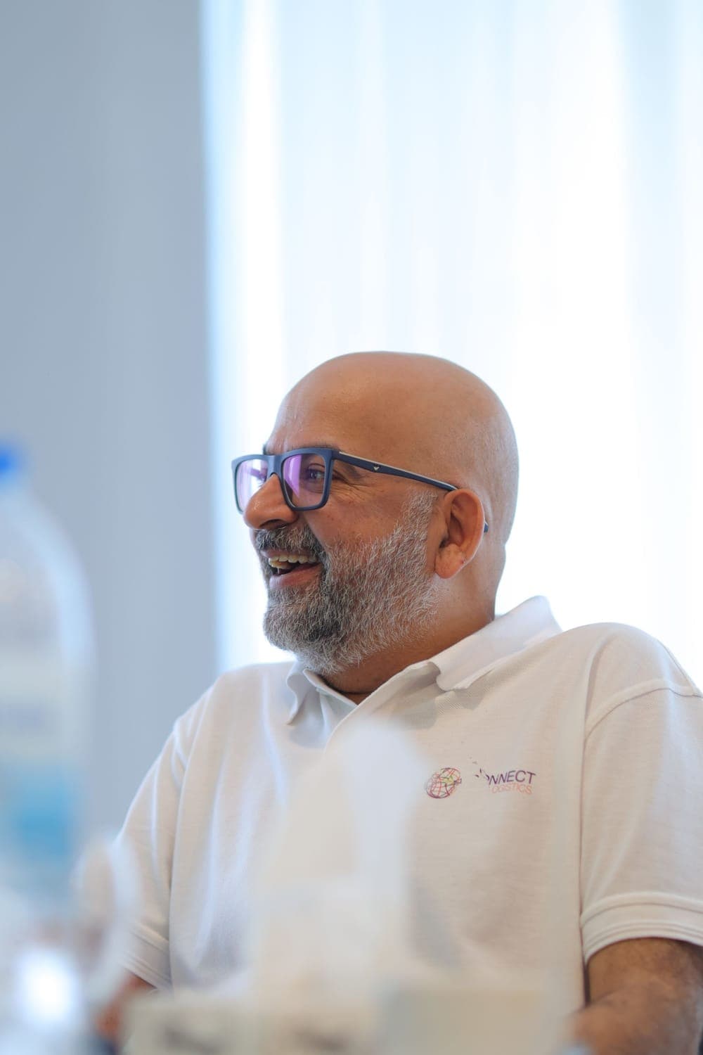 A colleague laughing during a discussion